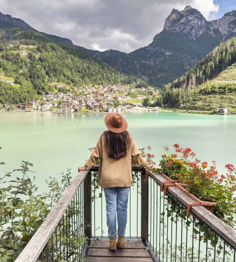 Woman overlooking a lagoon with mountains in the distance